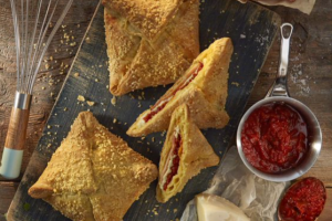 Handmade portion size pie with ham and chee