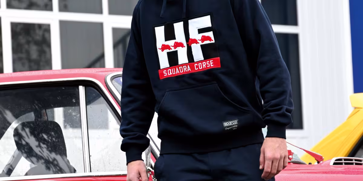 The HF Look is Back in Style: The New Lancia and Sparco Co-branded Sportswear Line Introduced at the “Rally Racing Meeting”