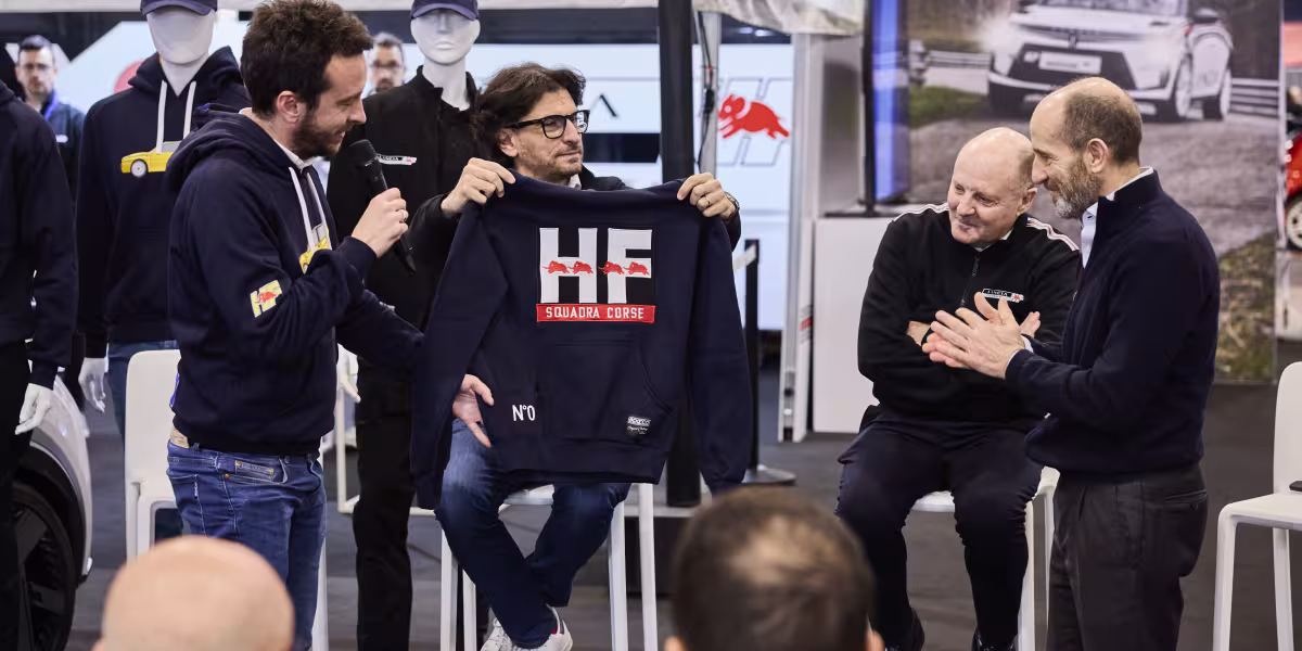 The HF Look is Back in Style: The New Lancia and Sparco Co-branded Sportswear Line Introduced at the “Rally Racing Meeting”