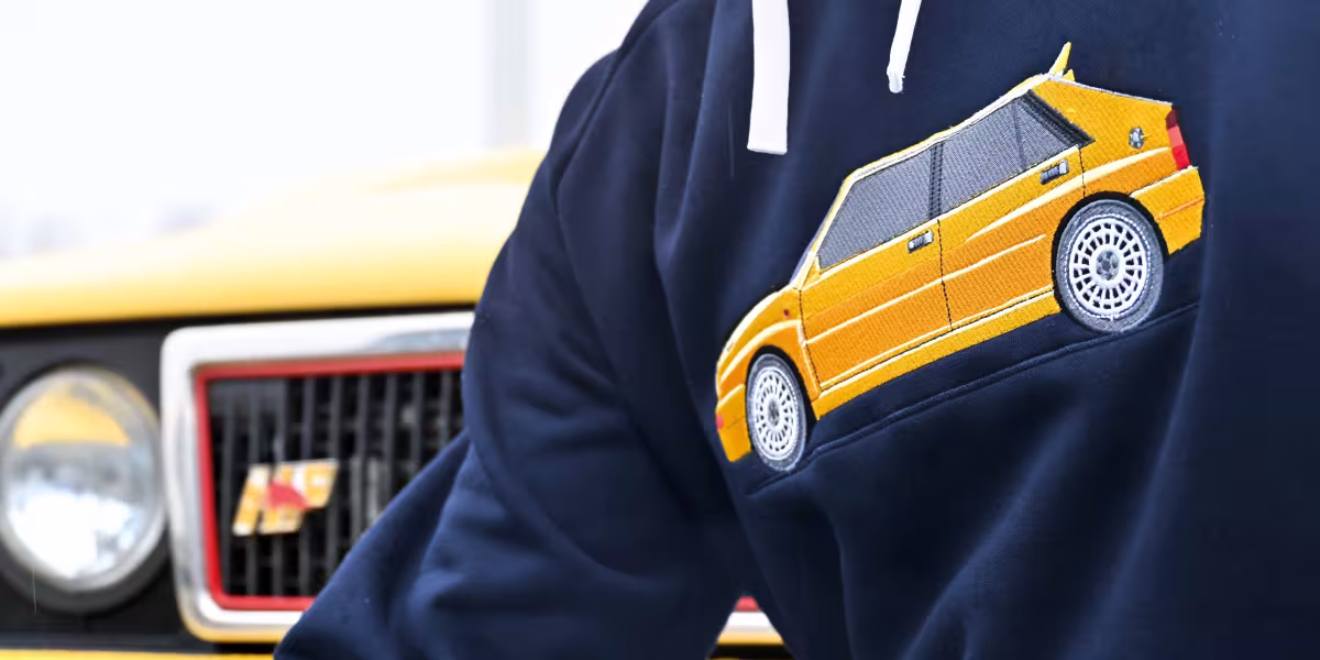 The HF Look is Back in Style: The New Lancia and Sparco Co-branded Sportswear Line Introduced at the “Rally Racing Meeting”
